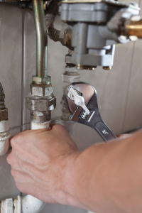 professional plumber fixing supply line